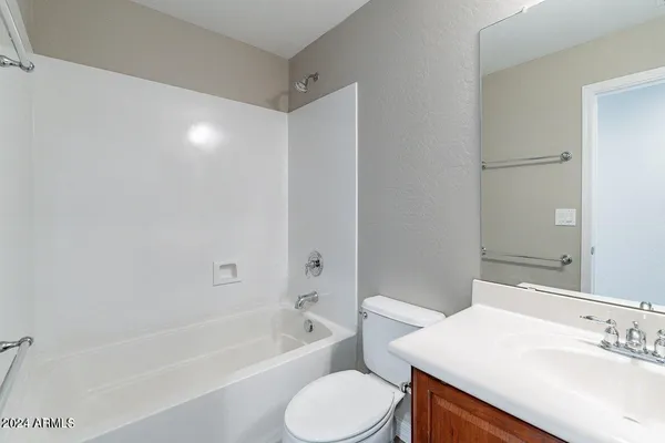 a bathroom with a sink toilet and bathtub
