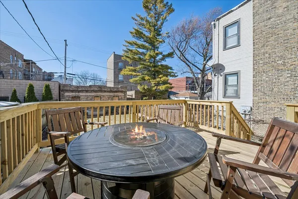 a view of a balcony and dining room