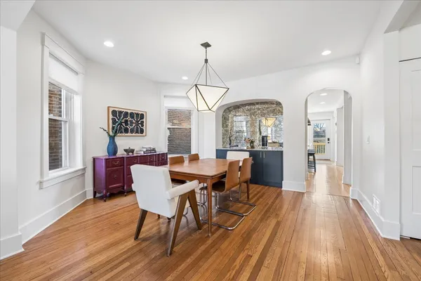 a view of a dining room with furniture window and wooden floor