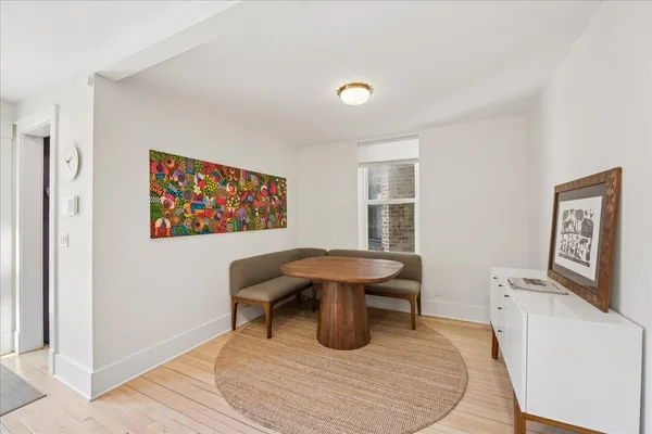 a work room with furniture and a large window