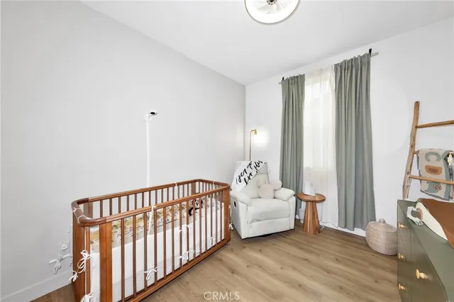 a view of a room with wooden floor and windows