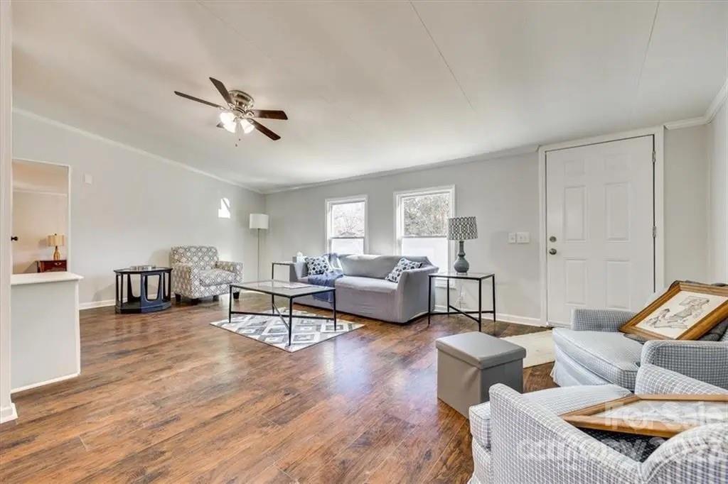 320 North Market Street Lancaster, SC 29720 - Photo 15 of 25 a living room with furniture and a wooden floor