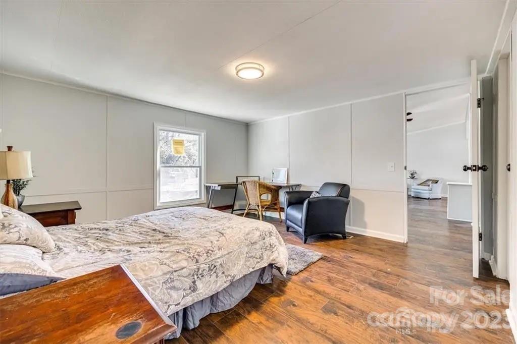 320 North Market Street Lancaster, SC 29720 - Photo 16 of 25 a bedroom with a bed and a couch