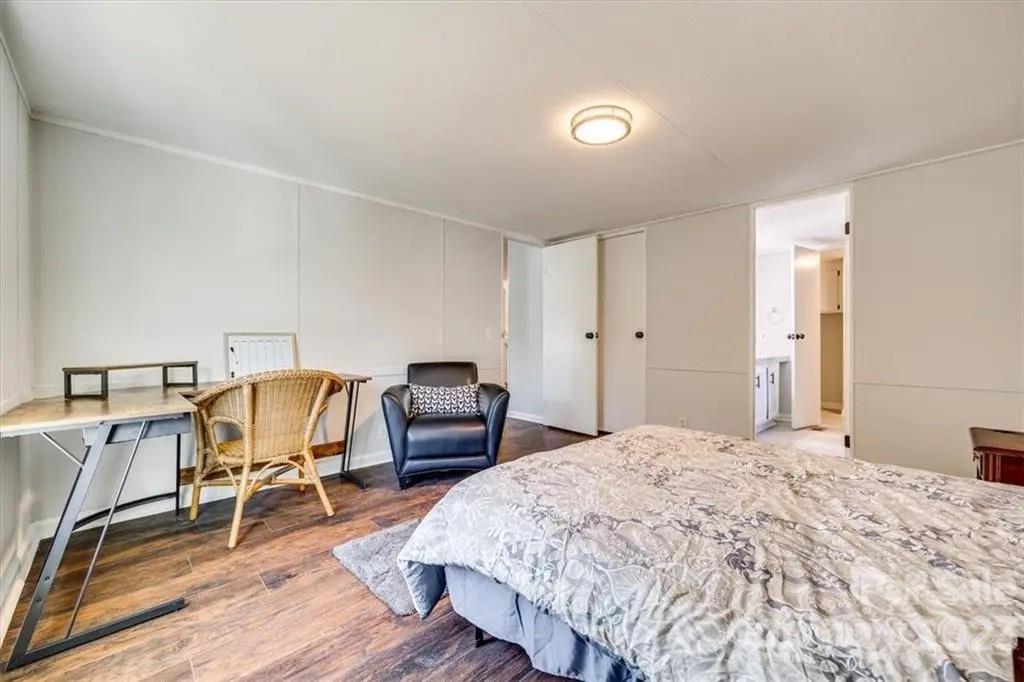 320 North Market Street Lancaster, SC 29720 - Photo 20 of 25 a bedroom with a bed and a chair