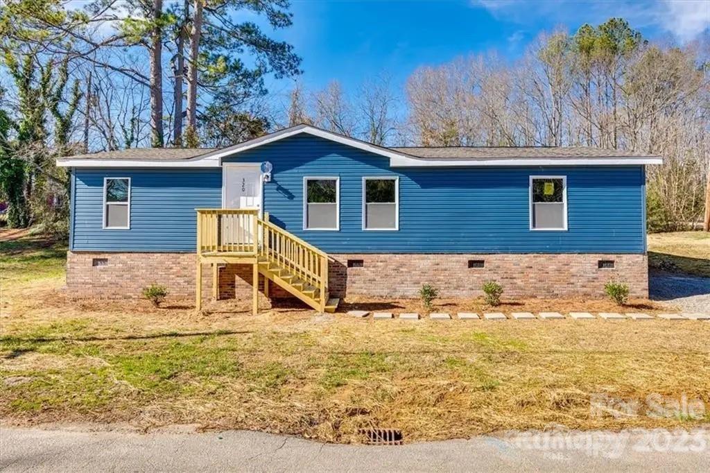 320 North Market Street Lancaster, SC 29720 - Photo 2 of 25 a view of house with a yard