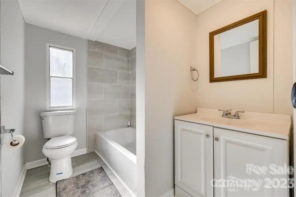 320 North Market Street Lancaster, SC 29720 - Photo 6 of 25 a bathroom with a sink toilet and shower