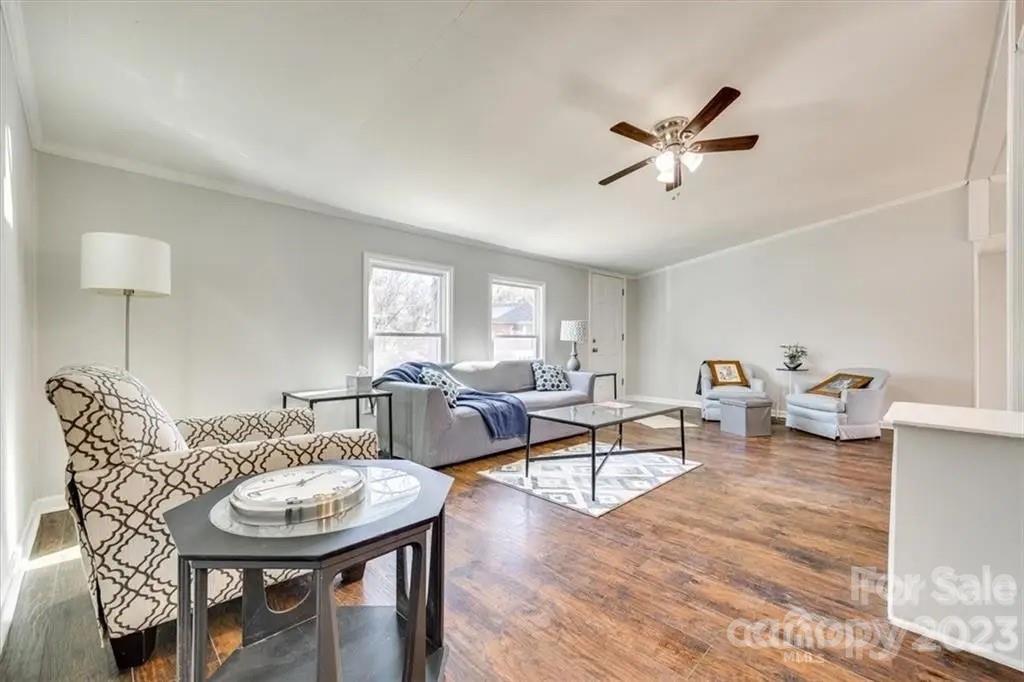 320 North Market Street Lancaster, SC 29720 - Photo 10 of 25 a living room with furniture and a wooden floor