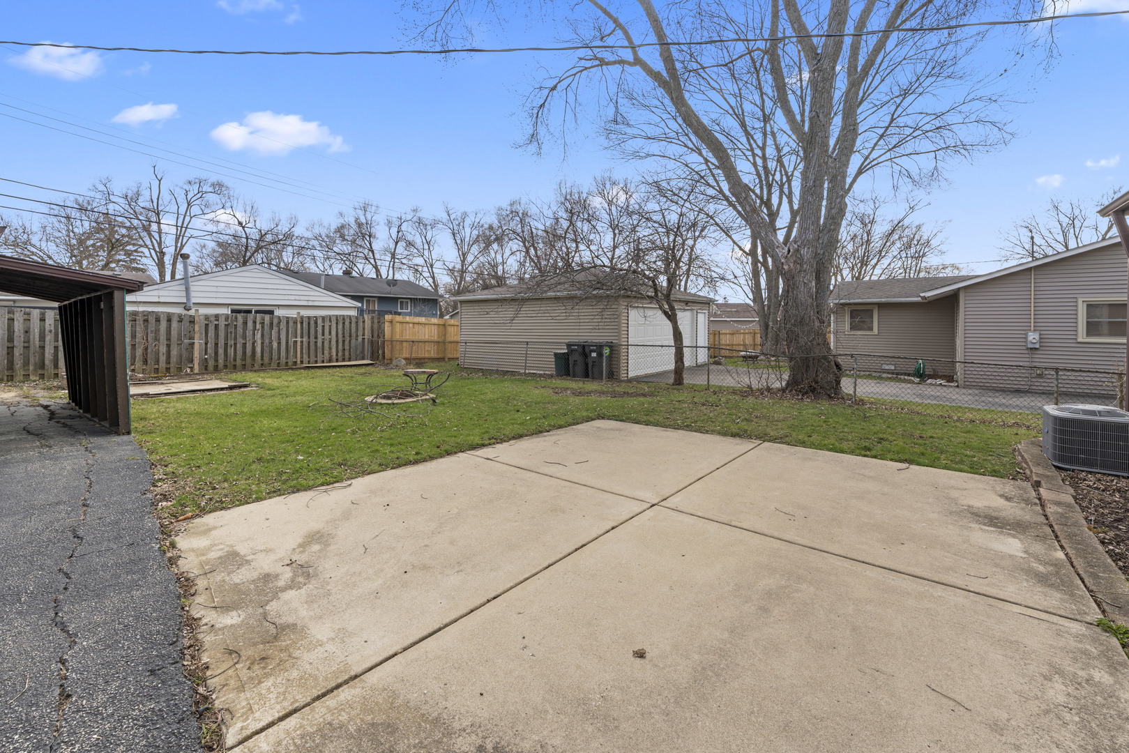25 McCabe Drive Streamwood, IL 60107 - Photo 12 of 32 a view of a backyard with large trees
