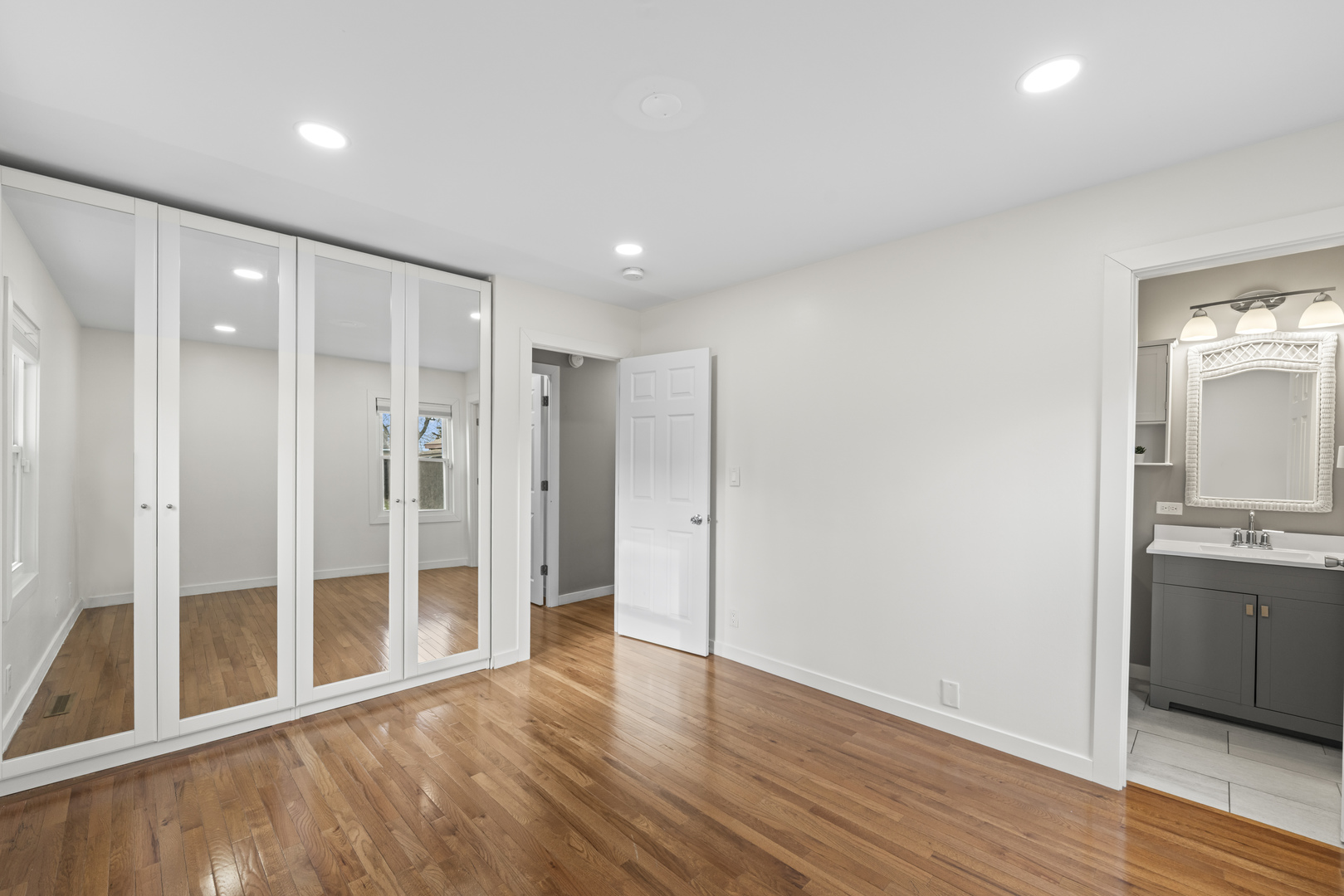 25 McCabe Drive Streamwood, IL 60107 - Photo 21 of 32 a view of a hallway with wooden floor and a bathroom