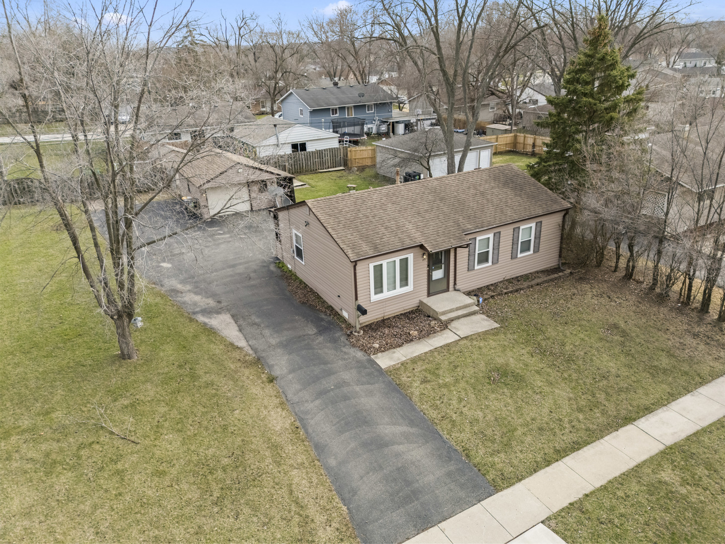 25 McCabe Drive Streamwood, IL 60107 - Photo 3 of 32 a view of a house with a yard and fence