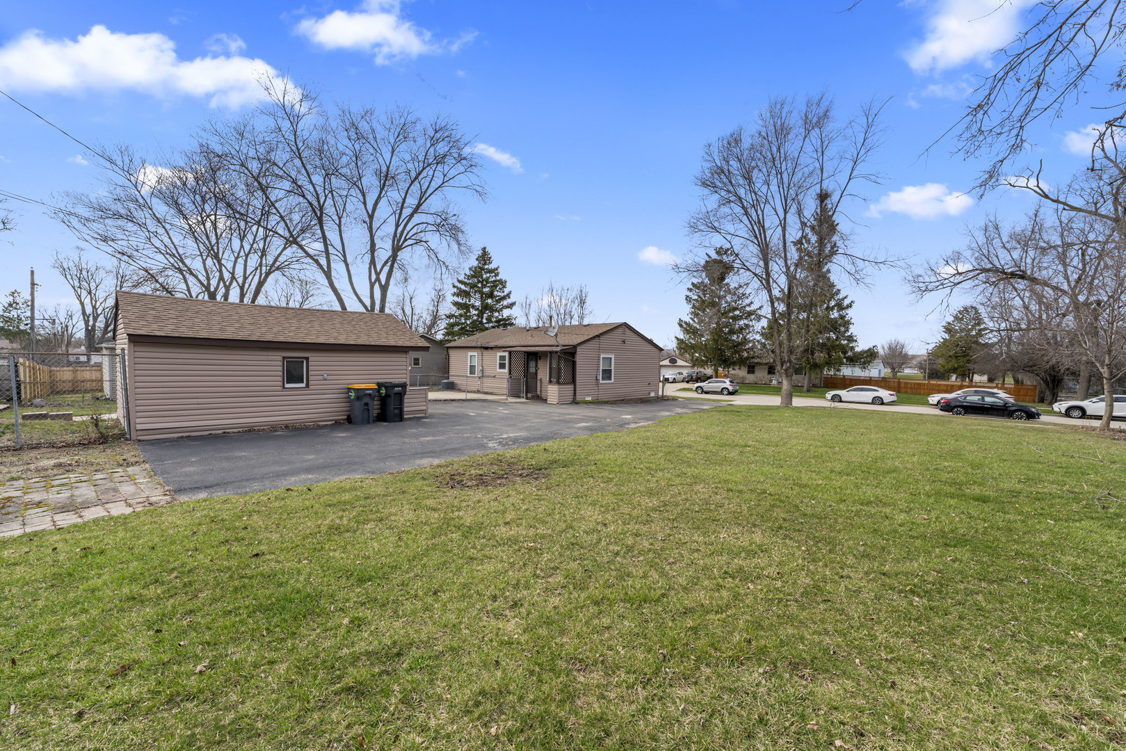 25 McCabe Drive Streamwood, IL 60107 - Photo 9 of 32 a view of house with outdoor space and sitting area