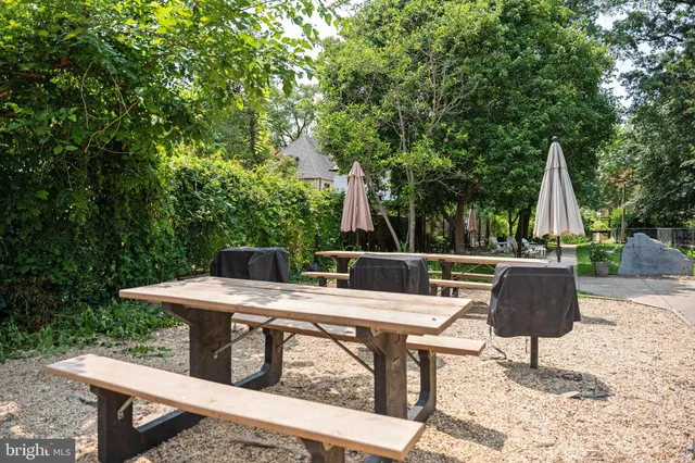 a view of backyard of house with seating area