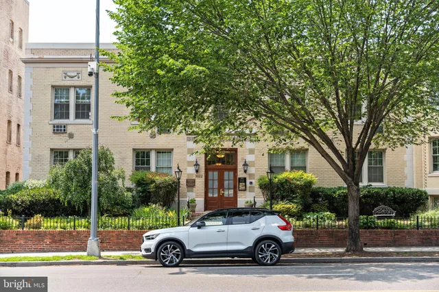 a car parked in front of a house