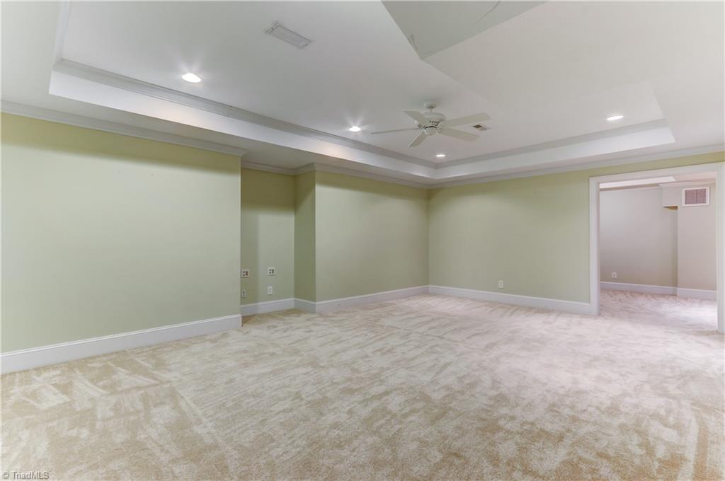 8511 Rosedale Drive Oak Ridge, NC 27310 - Photo 21 of 30 Home Theater? Hang out space? This bonus space is adaptable to many uses. Recessed ceiling lights, ceiling fan, and wall to wall carpet.