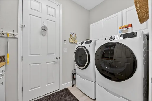 a utility room with dryer and washer