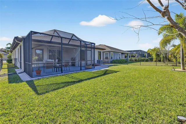 a view of a house with a big yard next to a yard