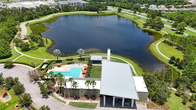 an aerial view of a house with a swimming pool