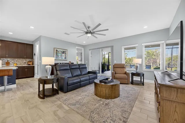 a living room with furniture and a large window