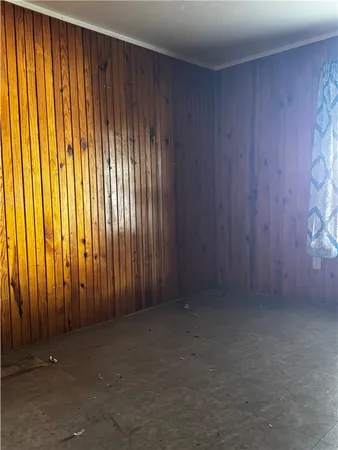 an empty room with a wooden door