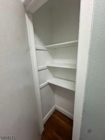 a view of an empty room and a window