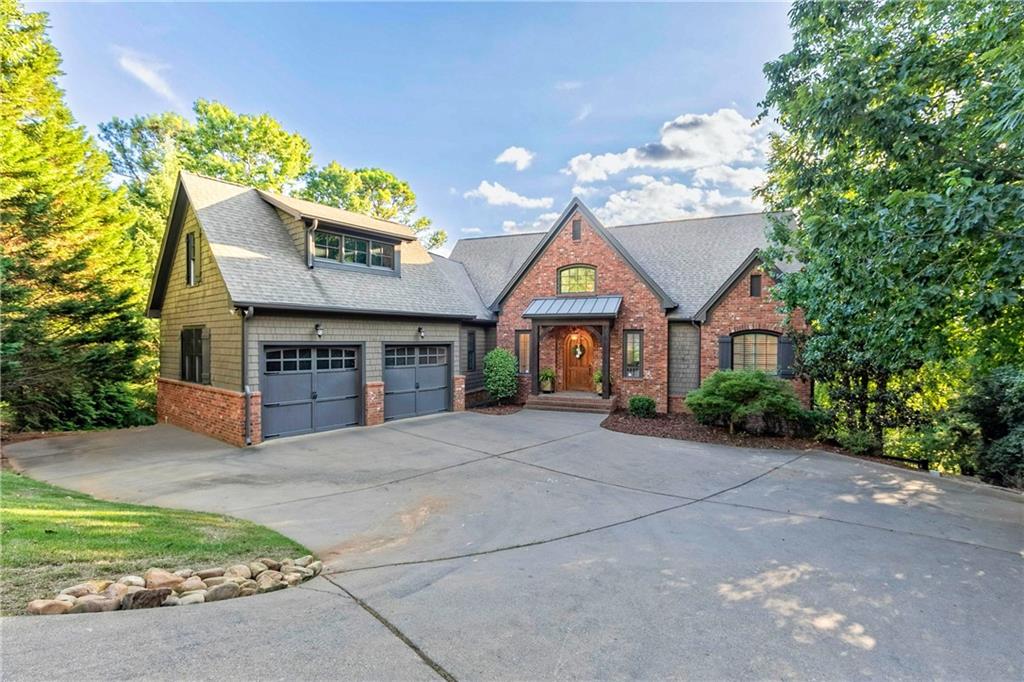 a front view of a house with yard