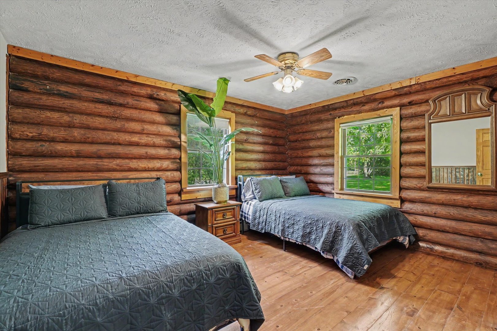 2431 North 1450 East Road Mansfield, IL 61854 - Photo 26 of 78 a bedroom with two beds and a chandelier