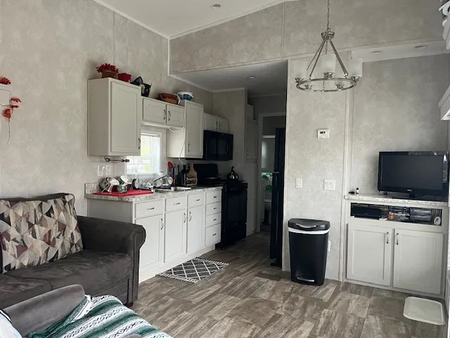 a kitchen with a stove and a refrigerator