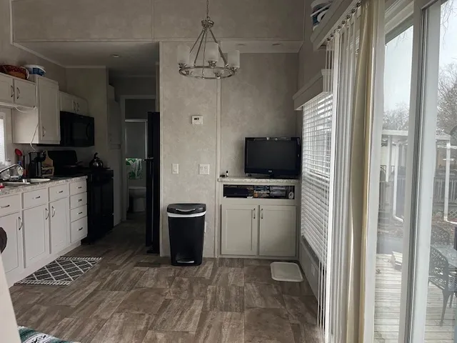 a kitchen with a refrigerator and a sink