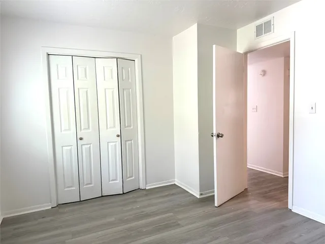 a view of a livingroom with wooden floor