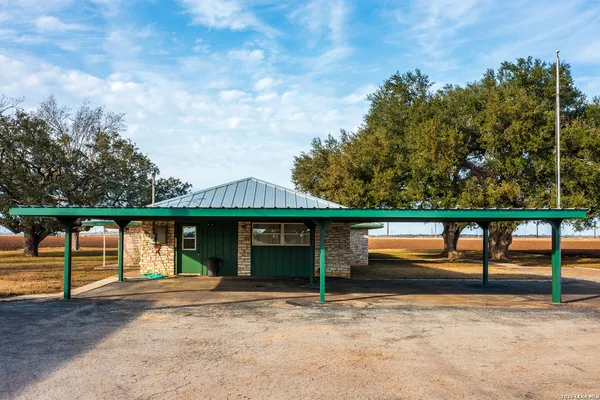 a view of swimming pool with an outdoor seating