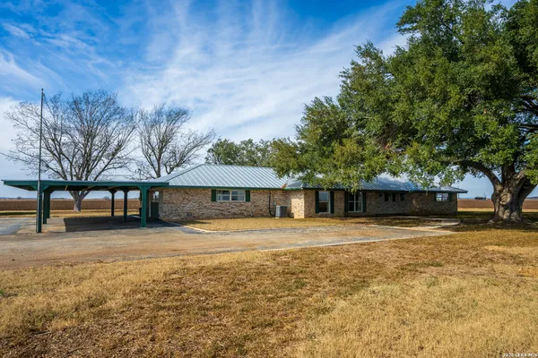 a backyard of a house with wooden floor