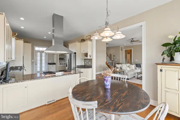 a view of a dining room with furniture and window