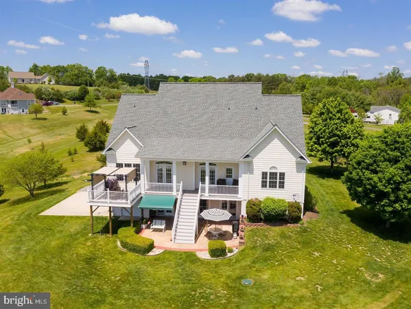 a view of a balcony with a yard
