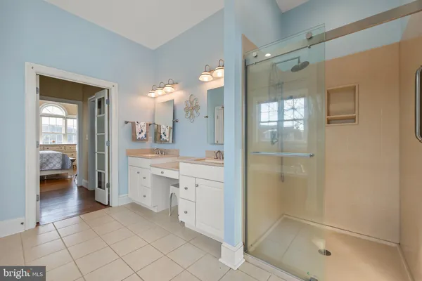 a bedroom with a large bed and a tv