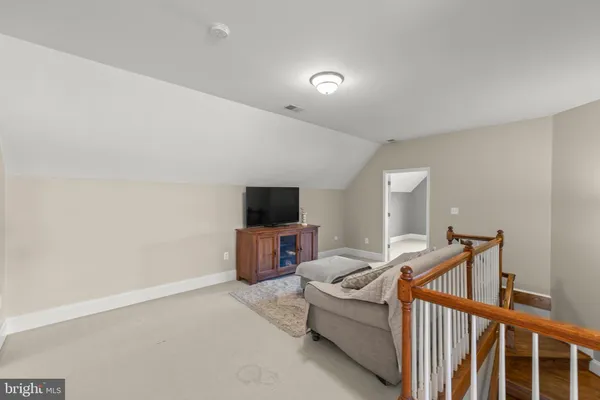 a bedroom with a bed and ceiling fan