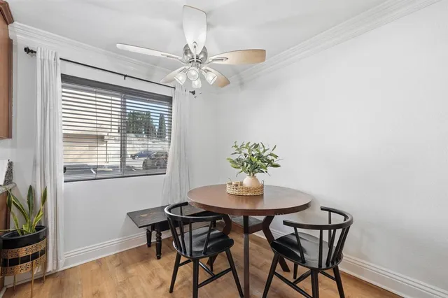 a dining room with furniture and window