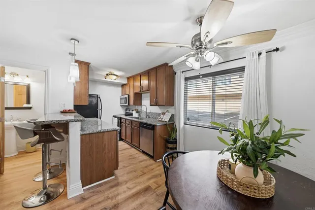 a dining room with furniture and wooden floor