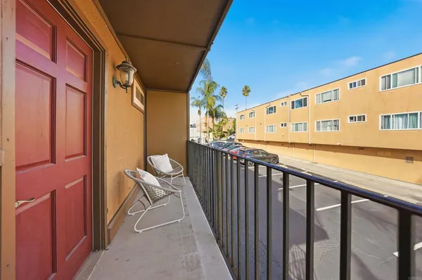 a view of balcony with furniture