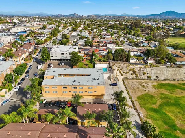 an aerial view of residential houses with outdoor space
