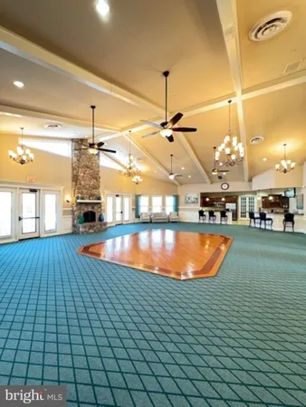 a view of a swimming pool with a lounge chair