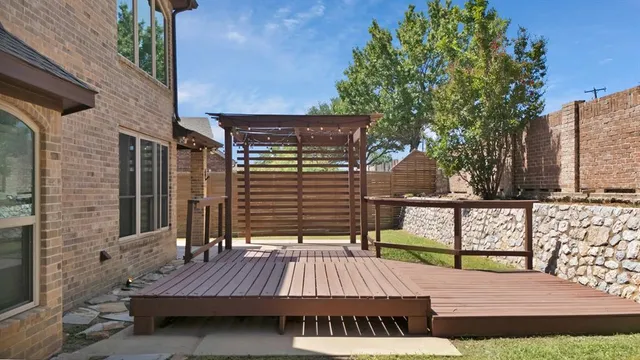 a view of a wooden deck with a bench
