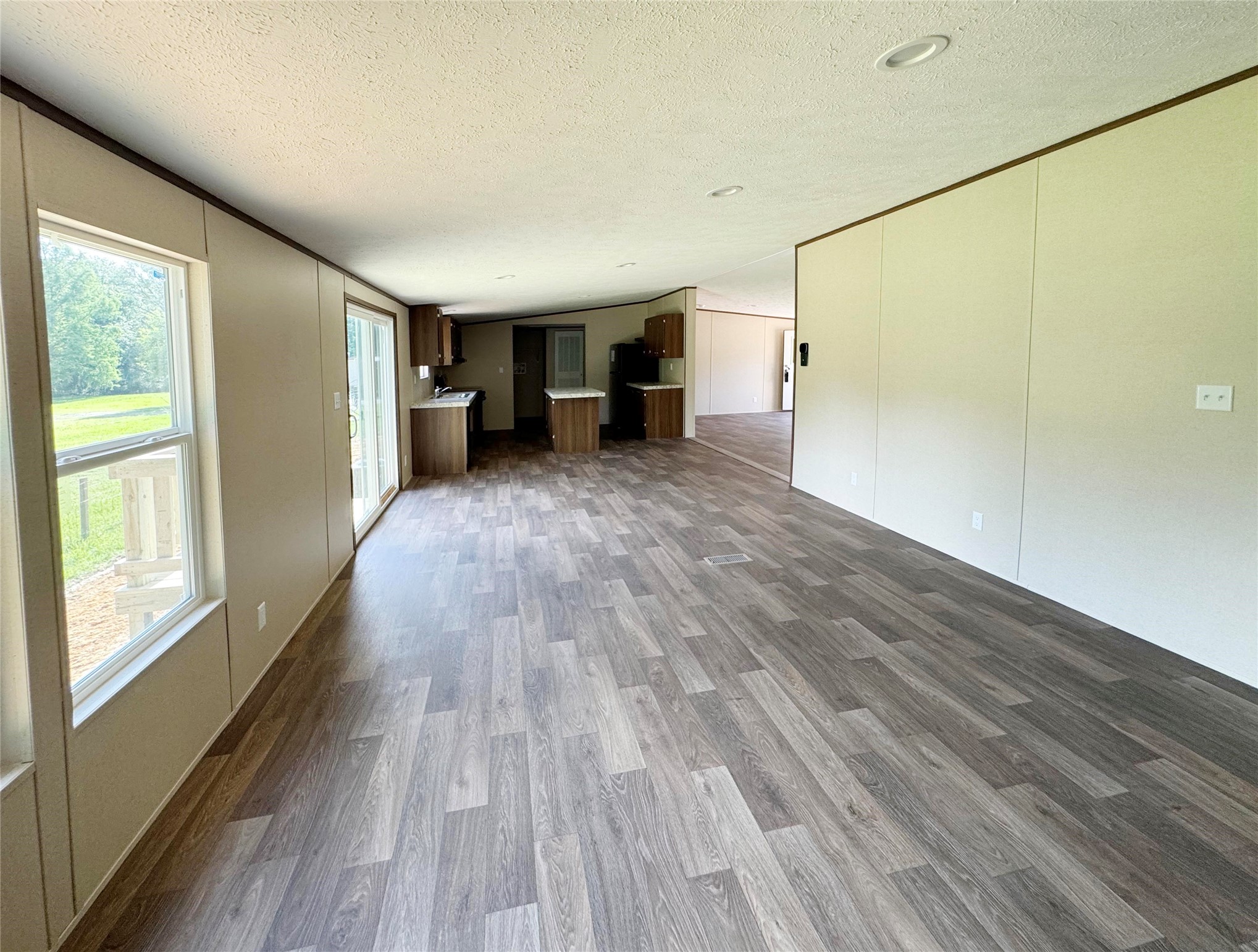 26817 Long Street Splendora, TX 77372 - Photo 13 of 18 a view of empty room with wooden floor and fan