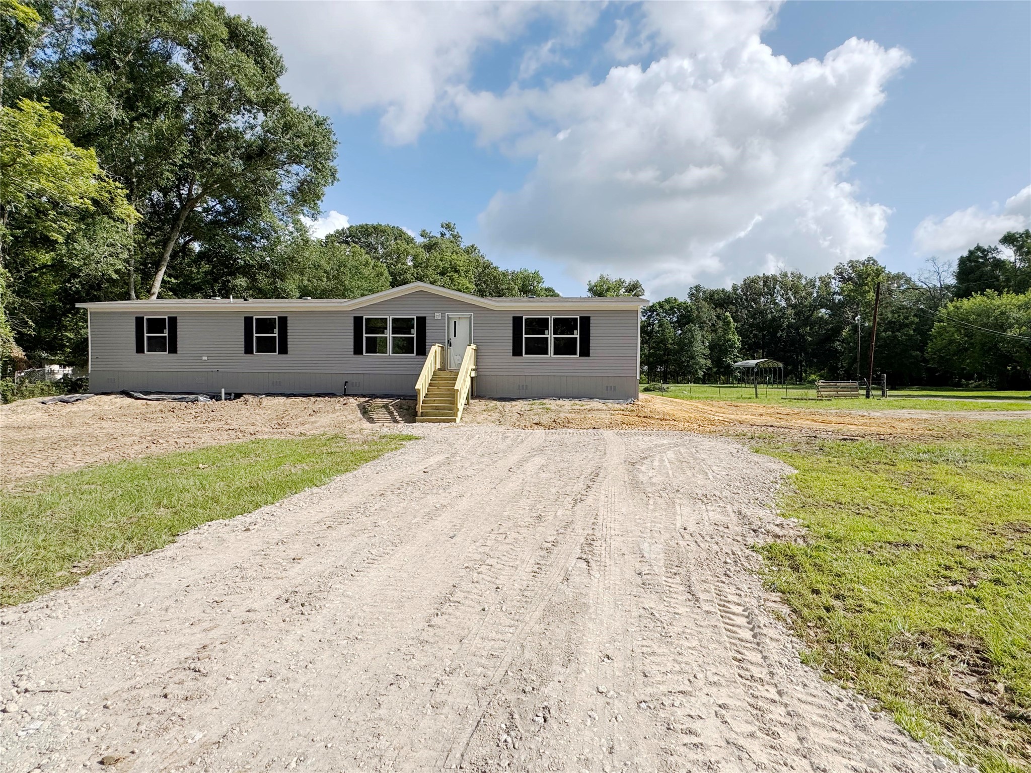 26817 Long Street Splendora, TX 77372 - Photo 2 of 18 a front view of a house with yard