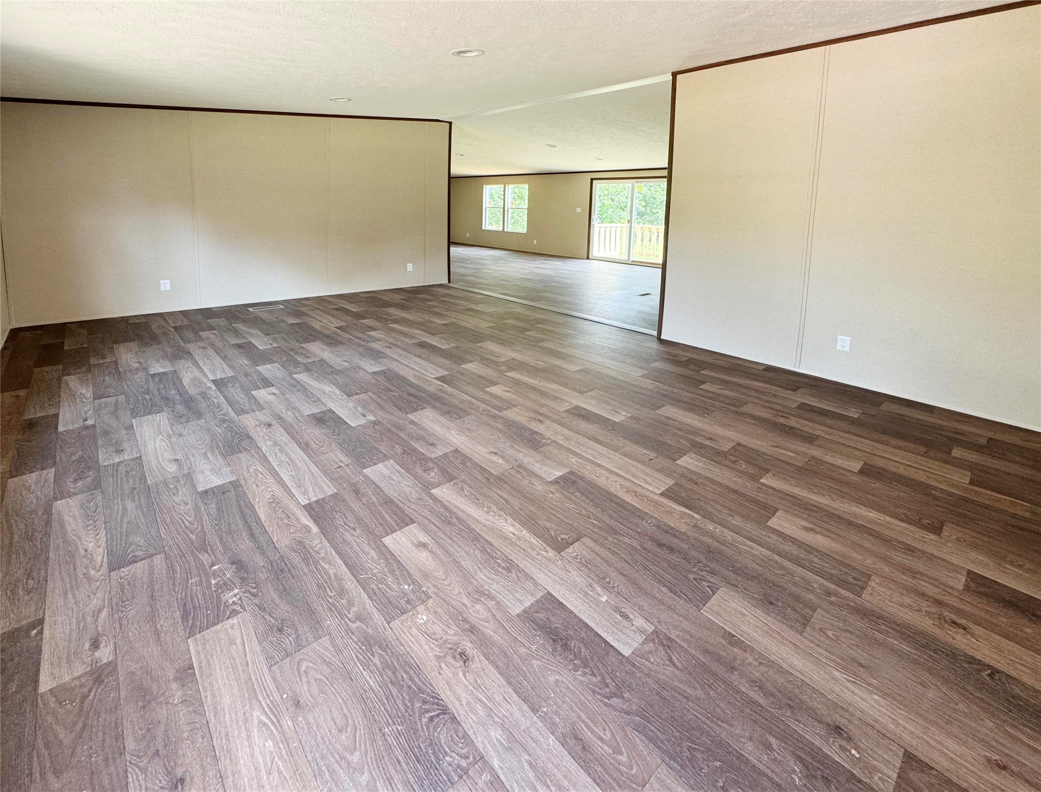 26817 Long Street Splendora, TX 77372 - Photo 4 of 18 a view of an empty room with wooden floor and a window