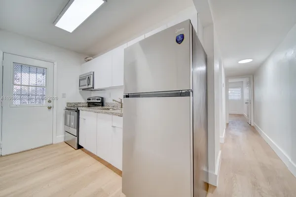 a view of a bathroom with wooden floor