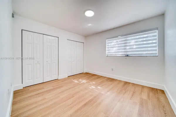 a view of room with walk in closet and window