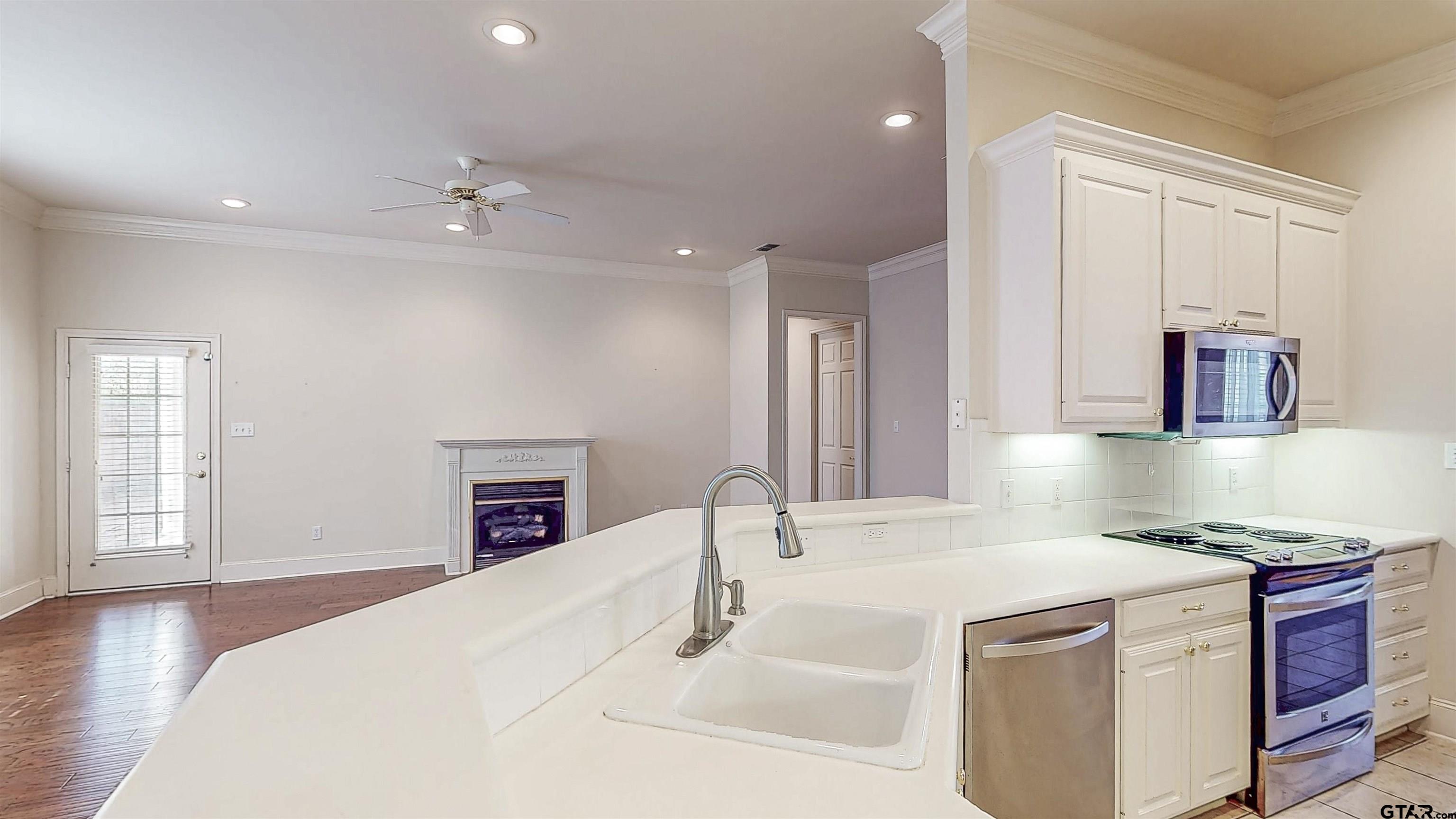 2435 Homestead Lane Tyler, TX 75701 - Photo 11 of 35 a spacious bathroom with a granite countertop sink and a mirror