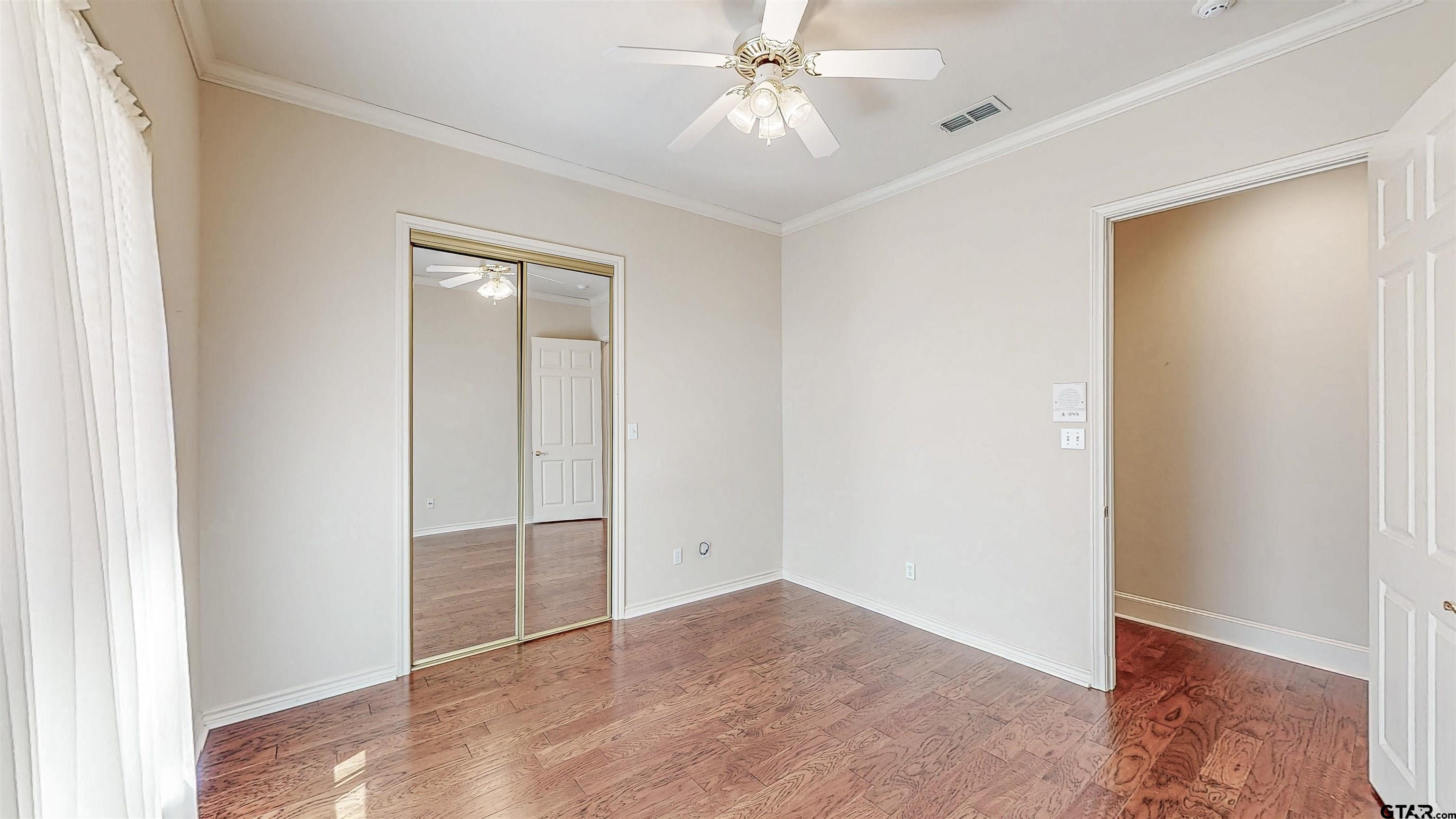 2435 Homestead Lane Tyler, TX 75701 - Photo 15 of 35 an empty room with fan and entrance