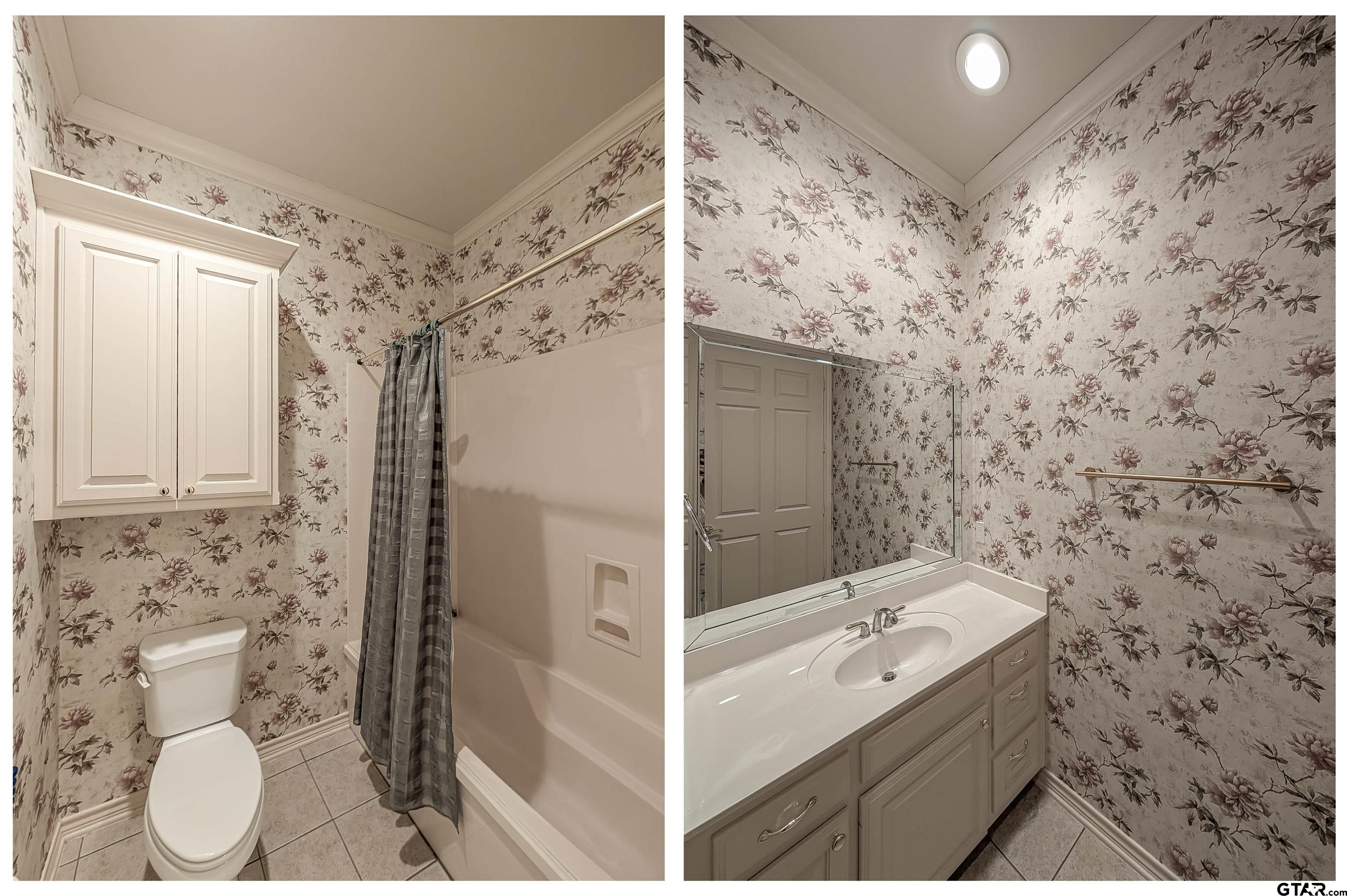 2435 Homestead Lane Tyler, TX 75701 - Photo 23 of 35 a bathroom with a sink and a shower