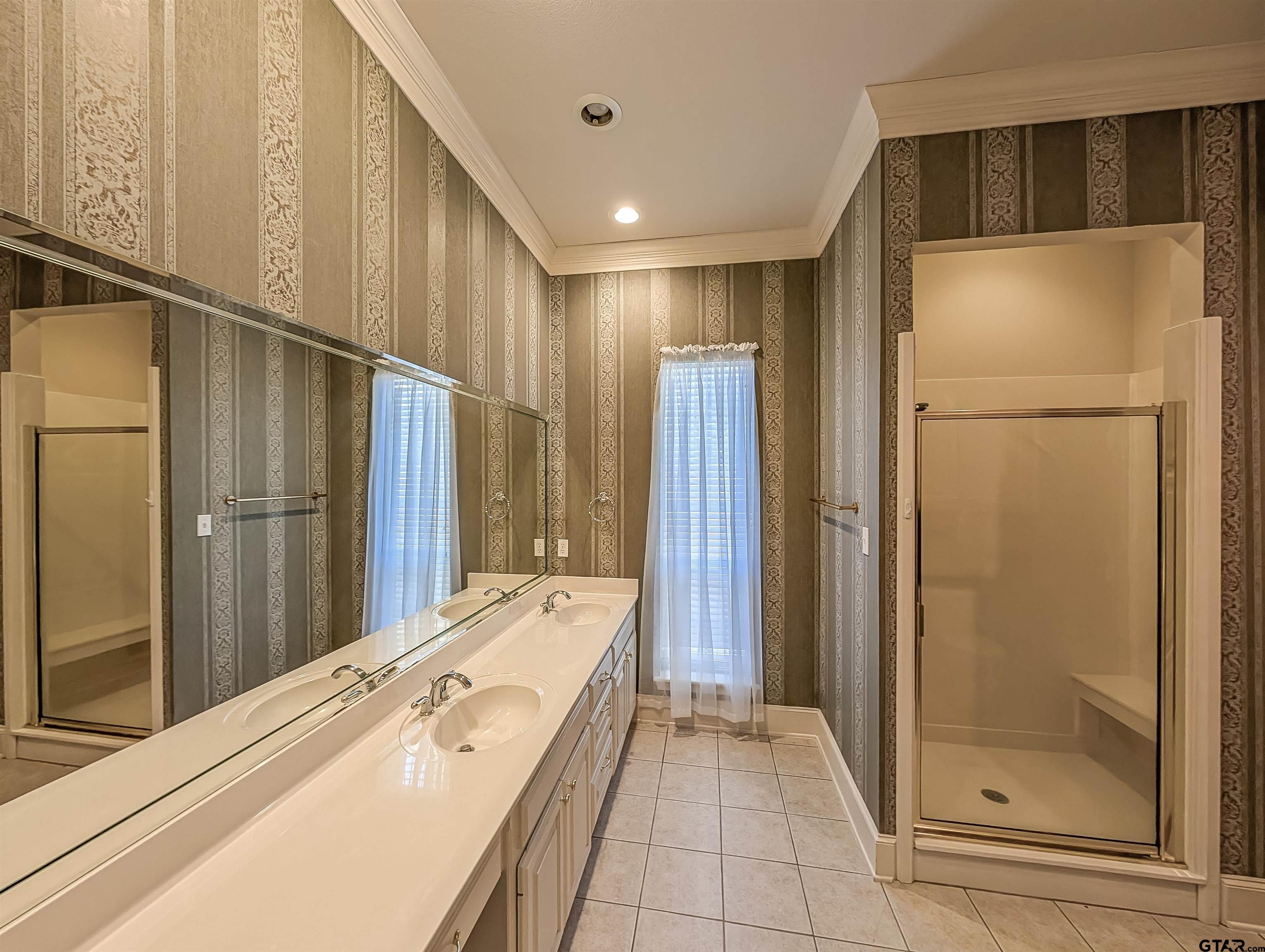 2435 Homestead Lane Tyler, TX 75701 - Photo 25 of 35 a bathroom with a tub and shower